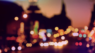 City street night clock tower - a blurry photo of a city street free wallpaper