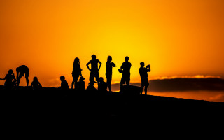 Sunset hill group backlighting silhouette - top of a hill free wallpaper