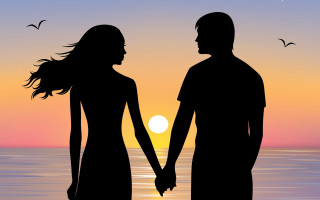 Beach sunset couple holding hands - the sun setting behind them free wallpaper for desktop