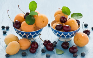Bowl fruit cherries peaches table - a bowl of fruit free wallpaper