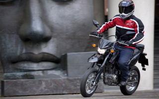 Man motorcycle statue face building - viennese actionism free wallpaper