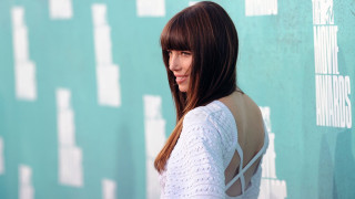 Woman long hair white top 9 - a blue background behind her free wallpaper