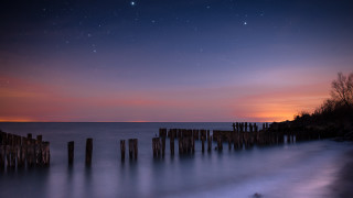 Sunset water pier starry night - sky free wallpaper