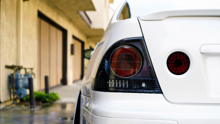 White car street building clock - the side of a street next free wallpaper