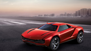 Red sports car city runway - a city skyline in the background free wallpaper