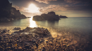 Rocky beach sunset ocean mountain - a rocky beach free wallpaper