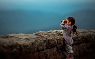 Little girl binoculars ocean cliff - sense of awe free wallpaper