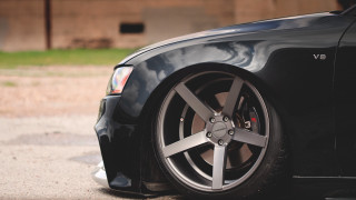 Black car black rim parking - low angle free wallpaper