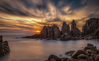 Rocky beach sunset clouds water 3 - rock free wallpaper