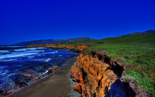 Cliff beach grassy watercity sky - a grassy area next free wallpaper