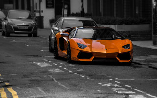 Orange sports car city street - nice looking orange sports car free wallpaper