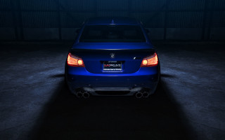 Blue car dark garage illuminated - a dark garage free wallpaper