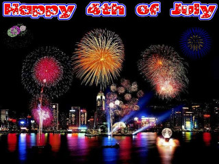 Fireworks city skyline water display - a fireworks display free wallpaper
