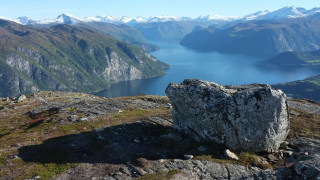 Large rock lake mountains snowy - a lake and mountains free wallpaper