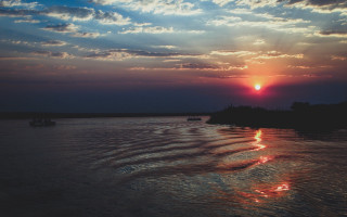 Sunset water boats clouds river - the water and a sky free wallpaper