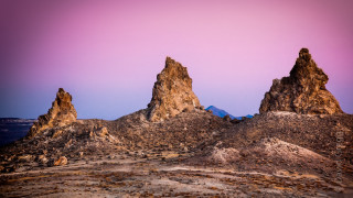 Desert rocks purple sky land - a purple sky in the background free wallpaper for desktop