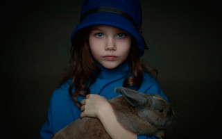 Young girl holding rabbit blue - a rabbit free wallpaper