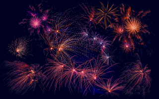 Fireworks night sky cityscape festival - a black border free wallpaper