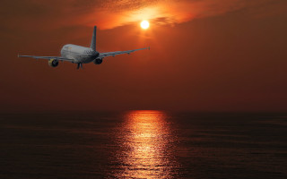 Plane ocean sunset backlit matte - over the ocean free wallpaper