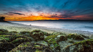 Sunset beach rocky shore people - a rocky shoreline free wallpaper