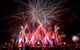 Fireworks crowd night city reflection - magical realism free wallpaper