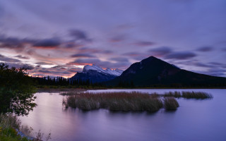 Mountain lake sunset forest sky - a lake in the foreground free wallpaper