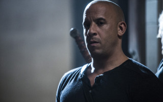 Bald man black shirt looking 2 - a man in the background free wallpaper