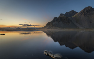 Mountain reflection lake sunset rock - the still water of a lake free wallpaper
