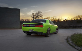 Green sports car driveway sunset - a driveway free wallpaper