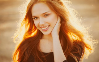 Woman smiling longhair portrait fire - free light wallpaper