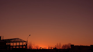 Building sunset streetlight constructivism cityscape - the background and a street light in the foreground free wallpaper