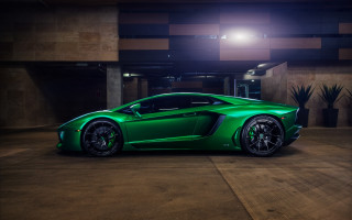Green sports car parking garage 2 - the side of the car free wallpaper
