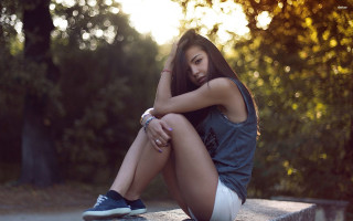 Woman sitting park bench crossed - her hand free wallpaper