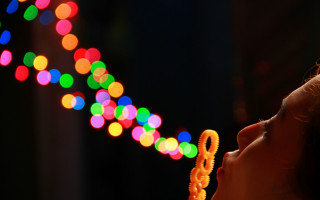 Young girl blowing out lights - a young girl free wallpaper for desktop