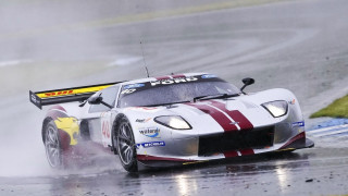 Racecar rainy track person helmet - a race car free wallpaper