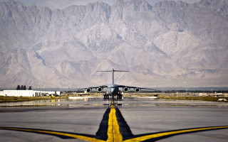 Airplane runway mountains yellow line 2 - amir zand free wallpaper
