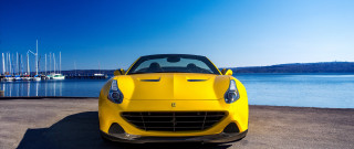 Yellow sports car beach water - a yellow sports car free wallpaper
