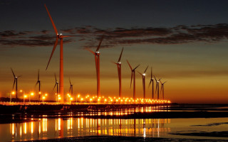 Wind turbines beach night sunset - the water and a sunset in the background free wallpaper