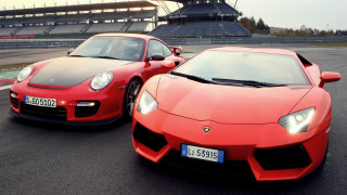 Red sports cars race track 2 - a stadium free wallpaper for desktop