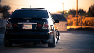 Black car sunset parking lot 2 - a license plate free wallpaper