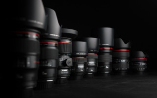 Camera lenses row black background - wide len free wallpaper