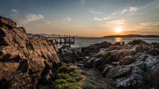 Wooden bridge sunset rocky shore - a rocky cliff free wallpaper