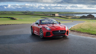 Red sports car lake road - a house in the background free wallpaper