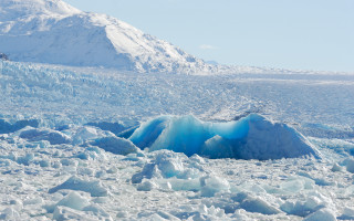 Large iceberg mountain snow blue - the ground in the foreground free wallpaper