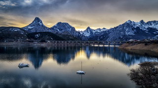 Lake bridge boats mountains clouds - cinematic photography free wallpaper for desktop