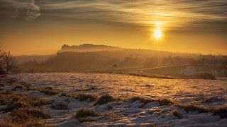 Snowy hill sunset cityscape ocean - a snowy field free wallpaper for desktop