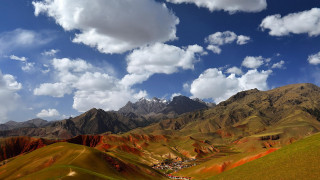 Mountain village clouds blue sky - colorful cloud free wallpaper