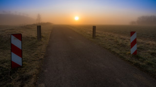 Road sign sunset foggy beach - a foggy day free wallpaper