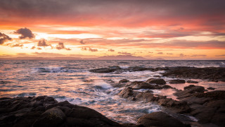 Sunset ocean rocks waves mountain - rich moody colour free wallpaper