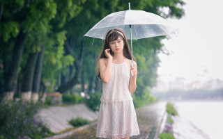 Woman white dress umbrella rain - an umbrella over her head free wallpaper
